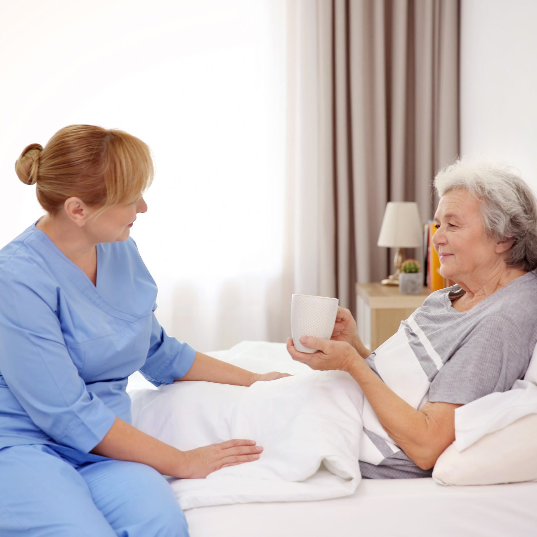 Senior,Woman,With,Caregiver,At,Home